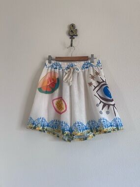 White Printed Mini Shorts with Blue Trim and Eye Motif